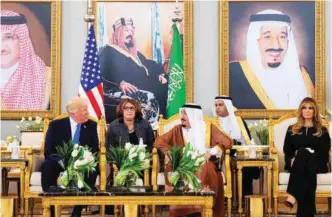  ??  ?? RIYADH: (Left) US President Donald Trump, First Lady Melania Trump and Saudi King Salman bin Abdulaziz stop for coffee in the terminal of King Khalid Internatio­nal Airport following Trump’s arrival yesterday. (Right) Trump receives the Order of...