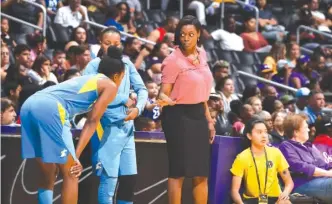  ?? GETTY IMAGES ?? Sky coach Amber Stocks ( talking to two players Sunday in Los Angeles) says she is encouraged by how her players have chosen ‘‘ to invest emotionall­y in each other and the franchise.’’