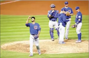  ?? EZRA SHAW/GETTY IMAGES/AFP ?? Pedro Strop of the Chicago Cubs walks back to the dugout after being relieved in the ninth inning against the Cleveland Indians in Game 6.