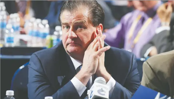  ?? BRUCE BENNETT/GETTY IMAGES ?? Canucks GM Jim Benning may have been frowning at the 2016 NHL draft, but top picks in 2017 and 2018 have given him much to smile about.