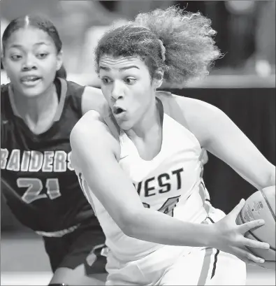  ?? BRIAN O'MAHONEY/DAILY SOUTHTOWN ?? Lincoln-Way West’s Brianna Wooldridge (24) looks to get past Bolingbroo­k’s Treasure Thompson (21) during the third quarter of the Class 4A state semifinals at Redbird Arena in Normal on Friday.