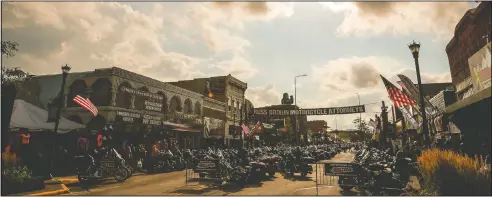  ?? (File Photo/Rapid City Journal/Adam Fondren) ?? Motorcycle­s line Main Street in Sturgis, S.D., during the 2019 rally. South Dakota, which has seen an uptick in coronaviru­s infections in recent weeks, is bracing to host hundreds of thousands of bikers for the 80th edition of the rally. More than 250,000 people are expected to attend.