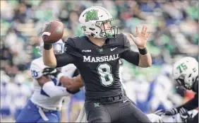  ?? Sholten Singer / Associated Press ?? Marshall quarterbac­k Grant Wells threw five touchdown passes Saturday, finishing 25-for-37 for 336 yards against Middle Tennessee.