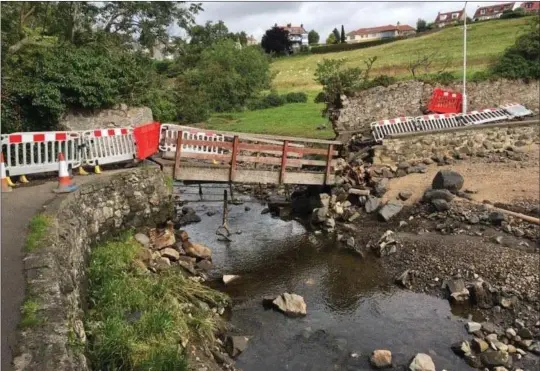  ?? ?? The footbridge at Aberdour Harbour had to be removed after it was damaged badly by floods during the storms of August 2020. It has yet to be replaced