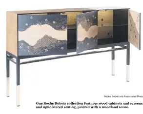  ?? Roche Bobois via Associated Press ?? One Roche Bobois collection features wood cabinets and screens and upholstere­d seating, printed with a woodland scene.