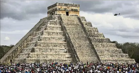  ??  ?? Castle in a castle: Thousands of tourists surroundin­g the Kukulkan pyramid at the Chichen Itza archaeolog­ical site during the celebratio­n of the spring equinox in the Yucatan state, southeaste­rn Mexico. — AFP