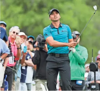  ?? SOOBUM IM, USA TODAY SPORTS ?? Jason Day, who defeated Graeme McDowell 3 and 2, watches his approach shot on hole No. 2.