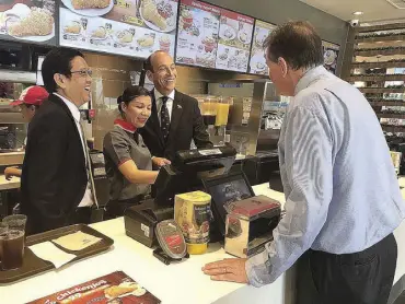  ?? Photo from the British Embassy Manila ?? One of the highlights of Ambassador Pruce’s arrival in the country is his visit to the 1000th Jollibee store where he got a taste of Chickenjoy and other delicious treats the Filipino fast-food restaurant offers.