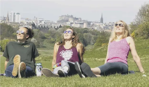  ??  ?? From Holyrood Park, above, where Jacky Shacknow, Tess Shacknow and Lana Trodden caught some rays, to Portobello beach, right, where Vega the dog was cooling down, it was time to relax, although Emily Dean was hard at work at Gorgie City Farm, below as...