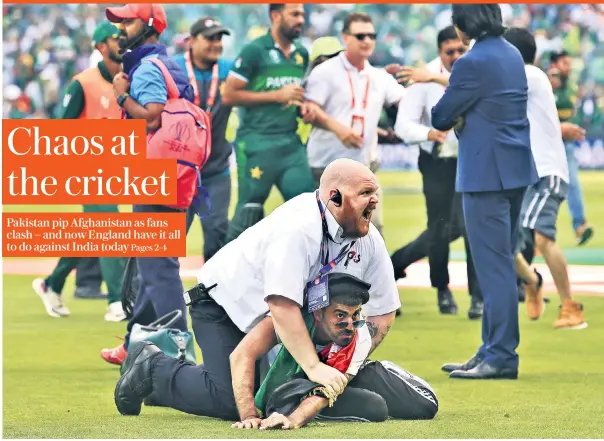  ??  ?? Day of shame: A steward grabs a fan following a pitch invasion at Headingley after Pakistan beat Afghanista­n with two balls to spare. Clashes between supporters were unpreceden­ted inside an English cricket ground