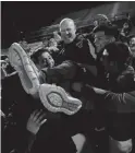  ?? MICHAEL CHOW/THE REPUBLIC ?? Washington soccer coach Adam Roberts is carried by his players after the team beat Arcadia 2-1 to win the Class 4A state soccer championsh­ip on Feb. 25.