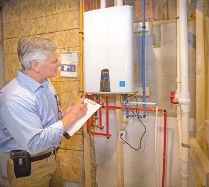  ??  ?? Tankless water heaters heat water only when you need it, reducing energy expenditur­e. (Frank Espich)