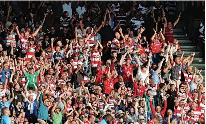  ?? Pictures: David Rogers/ Getty Images ?? Gloucester fans celebrate their team’s victory at the final whistle