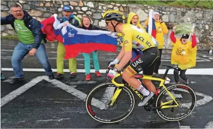  ?? Foto Dejan Javornik ?? Tadej Pogačar je na pedala stopil 4 km pred ciljem, kjer ga je čakalo največ slovenskih navijačev.