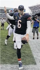  ?? Nam Y. Huh / Associated Press ?? Chicago quarterbac­k Jay Cutler runs off the field, ecstatic about the win.