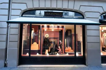  ??  ?? A window display of French fashion luxury goods house Hermes in in Paris. In May 2018 Hermes has opened its 34th US boutique in Palo Alto in the posh area of California. — AFP photo