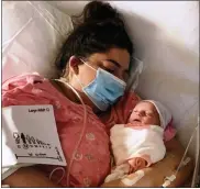  ?? PHOTO COURTESY OF RICKY DENNIS ?? Jackie Dennis shares a tender moment with her newborn baby girl, Mia Rose, on Nov. 27. Because of her positive COVID-19diagnosi­s and other medical issues related to the virus, she has not held her baby since that day.