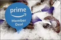  ?? DANIA MAXWELL / BLOOMBERG ?? A sign alerts Amazon.com Prime members of a special deal on shrimp during the grand opening of a Whole Foods Market location in Burbank, Calif., last month.