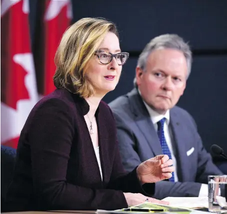  ?? JUSTIN TANG/THE CANADIAN PRESS ?? Bank of Canada governor Stephen Poloz and senior deputy governor Carolyn Wilkins announce the economic outlook in April. Most observers expect the central bank to lift interest rates to 1.5 per cent on July 11, which would be the first increase since...