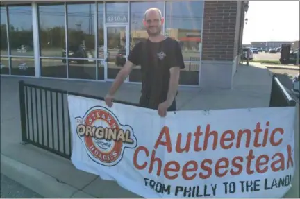  ?? RICHARD PAYERCHIN — THE MORNING JOURNAL ?? Josh Bierman, co-owner and chef of The Original Steaks and Hoagies, stands outside the space that will become the restaurant’s fourth and newest store in Lorain on Aug. 28.