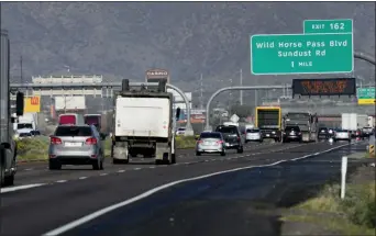  ?? MATT YORK/ASSOCIATED PRESS ?? Traffic moves along the notoriousl­y congested stretch of I-10through tribal land called the Wild Horse Pass Corridor, Wednesday, Jan. 25, 2023in Chandler, Ariz. With the Gila River Indian Community’s backing, Arizona allocated or raised about $600million of a nearly $1billion plan that would widen the most bottleneck-inducing, 26-mile section of I-10on the route between Phoenix and Tucson. But its request for federal money to finish the job fell short — a victim of the highly competitiv­e battle for transporta­tion grants under the new infrastruc­ture law.