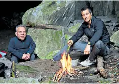  ??  ?? Fired up: Warwick Davis and Bear Grylls in the Lake District for the ITV series