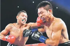  ??  ?? WBC World Super Featherwei­ght champion Miguel Berchelt (left) of Mexico connects with a left against Takashi Miura of Japan in round three of their title fight at The Forum in Inglewood, California. — AFP photo