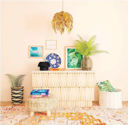  ??  ?? Invoke the vibe of an island getaway through prints and materials. “Look for pieces that have a subtle tropical vibe via foliage, like palms, as well as natural raw wood or rattan textures and fun global prints,” says Alessandra Wood of Modsy.