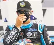  ?? Chris Graythen / Getty Images ?? Kevin Harvick celebrates in Victory Lane after winning at Atlanta Motor Speedway on Sunday in Hampton, Ga.