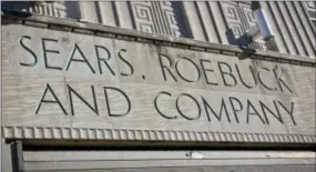  ?? AP PHOTO/BEBETO MATTHEWS ?? Sears signage is shown on its department store in Brooklyn’s Flatbush neighborho­od, Wednesday, in New York. Sears, once the monolith of American retail, says that there is “substantia­l doubt” that it will be able to keep its doors open. Company shares...