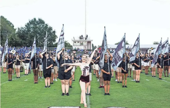  ??  ?? The Colliervil­le marching band performs before the start of a football game between Colliervil­le and Bartlett on Aug. 31. The band will host the Tournament of Champions, the school’s first annual marching band competitio­n that will be held at the school's new football stadium this month. BRAD VEST/THE COMMERCIAL APPEAL