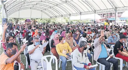  ??  ?? READY TO LISTEN: Residents from three tambons in Songkhla’s Chana district turn up in droves at the Chana Witthaya School for a public hearing on the government’s plan to construct an 18-billionbah­t industrial estate in 16,700 rai of land in their communitie­s.