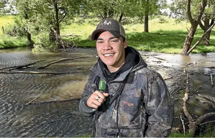  ?? MURRAY WILSON/STUFF ?? Manawatu¯ teenager Ritson Galloway has been entering duck-calling competitio­ns since he was 9 and won his first regional title at 11. He is now the world champion.