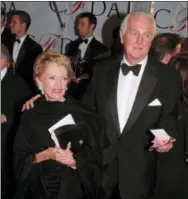  ?? PAUL HURSCHMANN — THE ASSOCIATED PRESS FILE ?? In this Feb.12 1996 file photo, Hubert de Givenchy arrives with his wife, Mary, at the Council of Fashion Designers of America 1996 Awards Gala at Lincoln Center in New York.