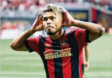  ?? CURTIS COMPTON PHOTOS / CCOMPTON@AJC.COM ?? Josef Martinez reacts Saturday after scoring vs. Orlando City for a 1-0 Atlanta United lead in the first half. He also assisted on one of two goals by Miguel Almiron, and Ezequiel Barco added a goal for United.