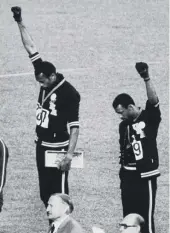  ?? GETTY IMAGES ?? American sprinters Tommie Smith and John Carlos give the Black Power Salute at the 1968 Olympics in Mexico City. They were subsequent­ly suspended from their team for their actions, and O J Simpson cited their treatment as one reason he avoided such protests.