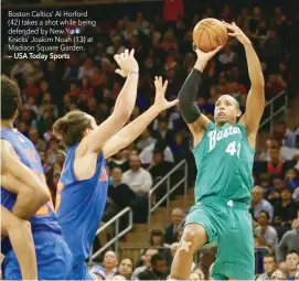  ?? — USA Today Sports ?? Boston Celtics’ Al Horford (42) takes a shot while being defended by New York Knicks’ Joakim Noah (13) at Madison Square Garden.