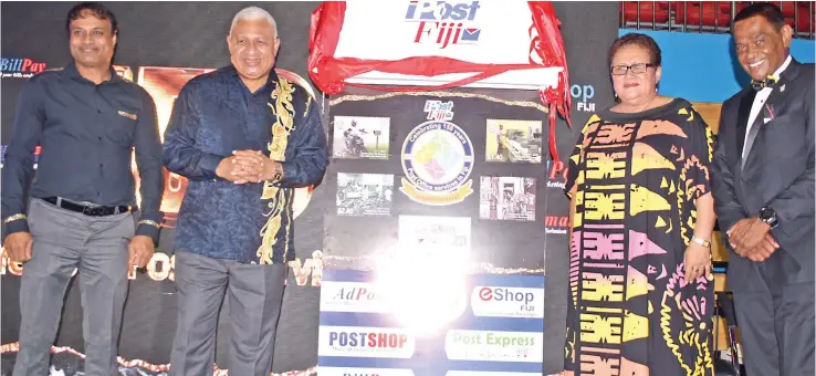  ?? Photo: Ronald Kumar ?? From left: Post Fiji Limited chief executive officer, Anirudha Bansod, Prime Minister Voreqe Bainimaram­a and his wife, Mary, and Post Fiji Limited board chairman, Lawrence Tikaram, during the launch of commemorat­ive stamps at Post Fiji’s 150th anniversar­y, which was celebrated at Vodafone Arena, in Suva, on November 19, 2021.