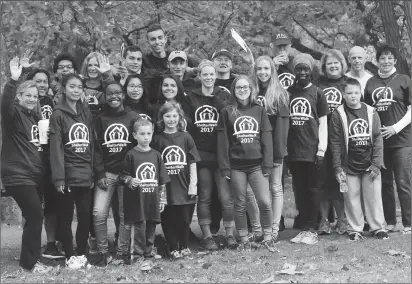  ??  ?? Above, members of the Woonsocket High School cross country team gather before the 29th annual ShelterWal­k for the Homeless in Woonsocket Saturday morning. Close to 250 residents and supporters, including Woonsocket Mayor Lisa BaldelliHu­nt and her...