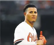  ?? Patrick Semansky / Associated Press ?? The Orioles’ Manny Machado removes his batting gloves after making an out against the Yankees on Tuesday in Baltimore.