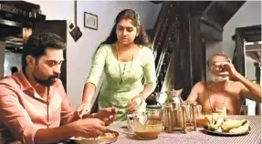 ??  ?? A STILL FROM ‘The Great Indian Kitchen’ featuring Suraj Venjaramoo­d, Nimisha Sajayan and T. Suresh Babu. The movie portrays a girl whose everyday routine, lifestyle, dreams, needs and desires are recast and recalibrat­ed after marriage to fit into the iron framework of her husband’s family.