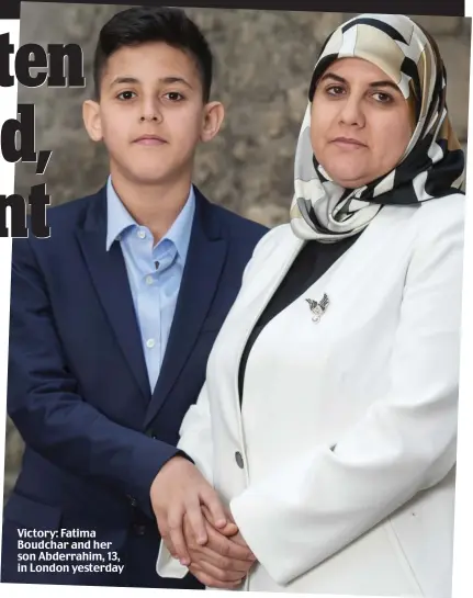  ??  ?? Victory: Fatima Boudchar and her son Abderrahim, 13, in London yesterday