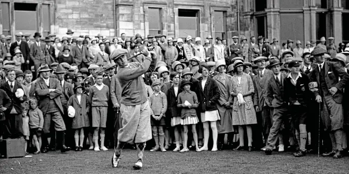  ?? GETTY IMAGES ?? Feather in his cap: American Bobby Jones draws the well-dressed crowds at St Andrews in 1927, on the way to retaining his status as Open champion