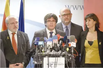  ?? — AFP ?? Axed Catalan President Carles Puigdemont gives a press conference on Friday in Brussels.