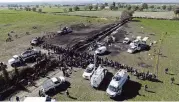  ?? CLAUDIO CRUZ AP ?? Forensic experts search the area of an oil pipeline explosion in Tlahuelilp­an, Hidalgo state, Mexico, Saturday.