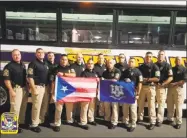 ?? Contribute­d photo ?? Thirteen Connecticu­t state troopers prepare to depart for Puerto Rico, where they are to assist in recovery efforts after Hurricane Maria.