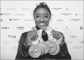  ?? [MARIJAN MURAT/VIA AP FILE] ?? U.S. gymnast Simone Biles was named Associated Press Female Athlete of the Year. She is the first gymnast to win the award twice and the first to win it in a non-Olympic year.