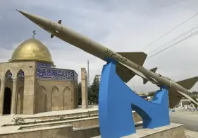  ?? Associated Press ?? A missile is on display with a sign on it reading in Farsi: “Death to Israel” in front of a mosque in the shape of the Dome of the Rock of Jerusalem in a town near Tehran, on April 21.