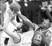  ?? BOB DONNAN/USA TODAY ?? Warriors swingman Andre Iguodala, right, attempts to block a shot by Cavaliers forward Kevin Love during Game 6 of the NBA Finals on Thursday at Cleveland. Iguodala was limited by a sore back, but says he’ll be ready to play Sunday in Game 7 at...