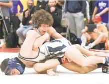  ?? DAVID GARRETT/SPECIAL TO THE MORNING CALL ?? Northampto­n’s Carson Wagner, back, is aiming for a Class 3A East Super Regional title at 106 pounds Saturday at Quakertown H.S.